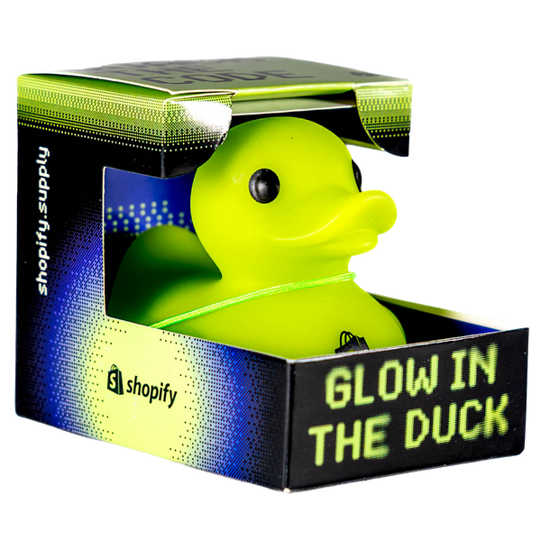 Glow in the Duck, a neon green rubber duck in a black and green box with Shopify branding